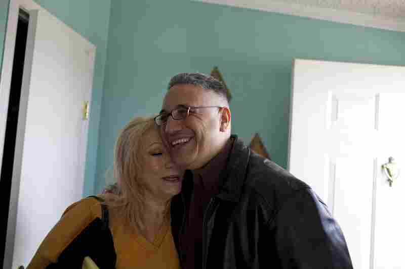 Ernie Lopez hugs his mother, Rosie Lopez, after entering the family home for the first time since his conviction in 2003.