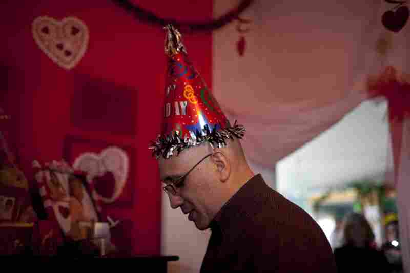 Lopez walks through his bedroom at his parents' house. As part of the homecoming celebrations, each room in the house was decorated for a different holiday. His room was decorated for Valentine's Day and Father's Day.