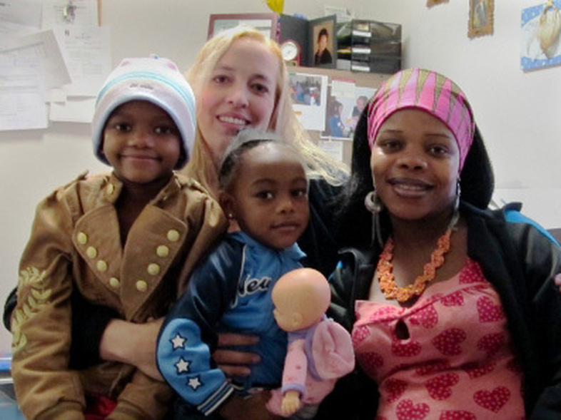 Nowela Virginie and her daughters often visit social worker Marcia Munden at Catholic Charities of Idaho. (Molly Messick/StateImpact)