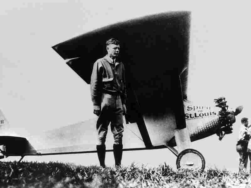 American aviator Charles Lindbergh poses in front of his monoplane Spirit of St-Louis at Paris-Le Bourget, May 21 1927, after having achieved the first solo non-stop transatlantic flight from New York to Paris.
