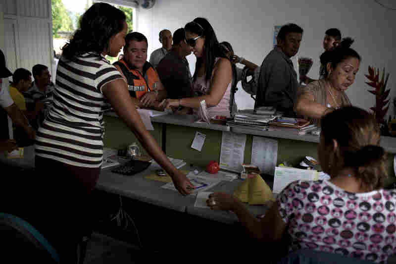 Sadelca airline vendors sell plane tickets and cargo space to customers in Villavicencio's airport in southeastern Colombia.