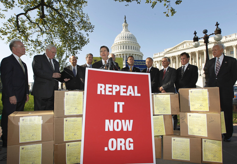 Sen. Jim DeMint, R-S.C., center, joins other conservative lawmakers on Capitol Hill to criticize President Obama's health care law on Oct. 5, 2011. They said the boxes were packed with petitions asking Congress to repeal the Affordable Care Act. (J. Scott Applewhite/AP)