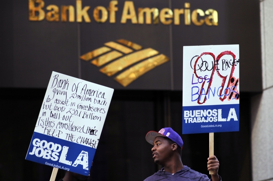 Occupy L.A. activists rally outside the Bank of America Plaza in Los Angeles in February. The Occupy protests around the country have inspired two working groups that are attempting to reform the banking system and create an alternative bank. (Damian Dovarganes/AP)