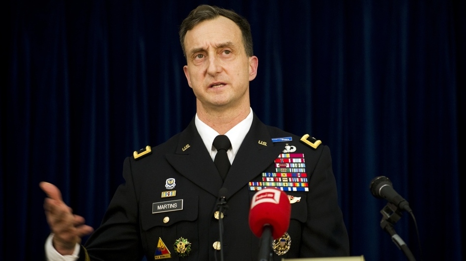 Brig. Gen. Mark Martins, the chief prosecutor at Guantanamo Bay, graduated first in his class at West Point, studied as a Rhodes scholar, and attended Harvard Law School. Here he speaks during a press conference at the military facility on Jan 18. following a hearing against Abd al-Rahim al-Nashiri, the main suspect in the bombing of the USS Cole in 2000. (Jim Watson/AFP/Getty Images)