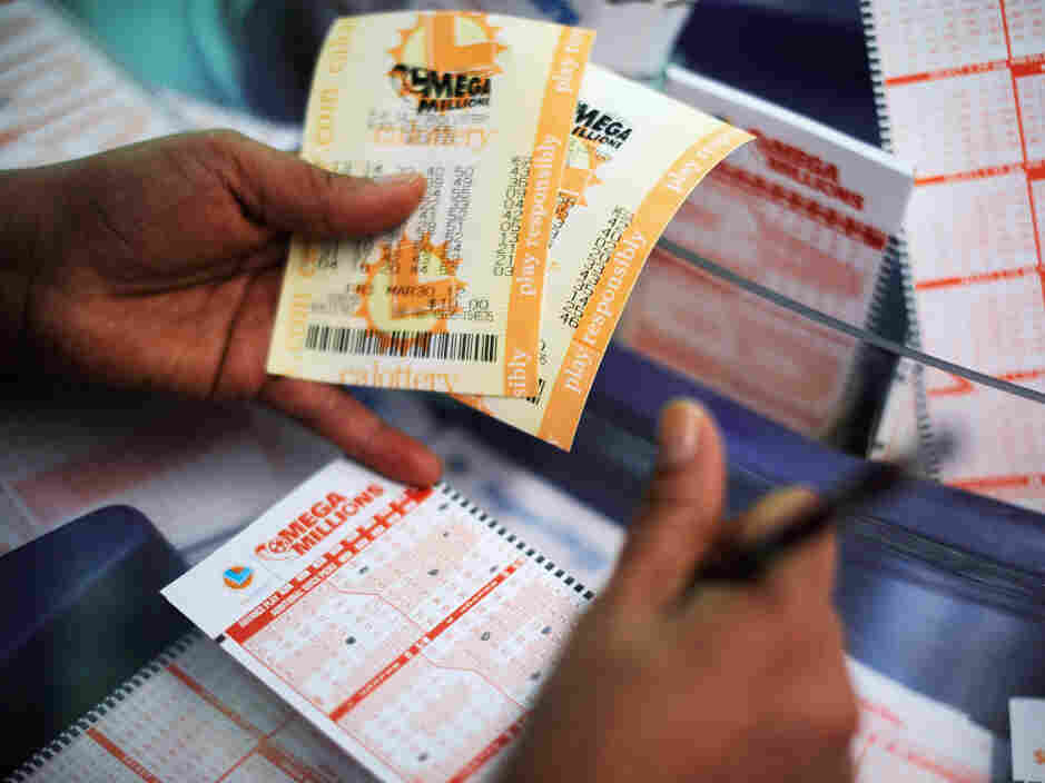 Buying Mega Millions tickets Friday in Covina, Calif.