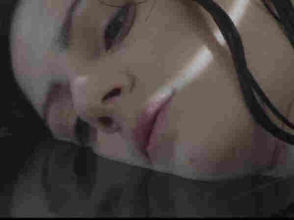 Sinking into something: Aleksa Palladino in a still from the video for Exitmusic's "Passage."