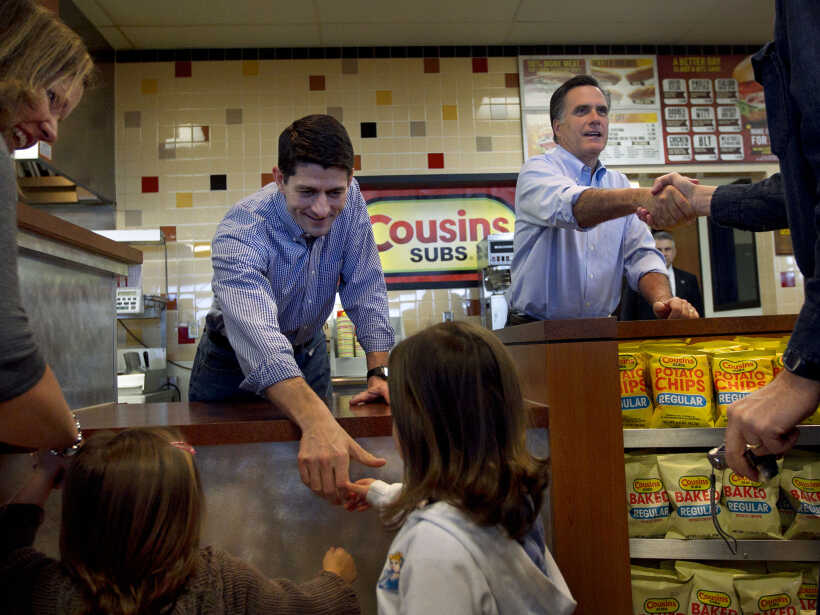 Republican presidential candidate, former Massachusetts Gov. Mitt Romney, accompanied by House Budget Committee Chairman Rep. Paul Ryan, R-Wis, greet people and hand out submarine sandwiches during a campaign stop at a Cousins Subs fast food restaurant in Waukesha, Wis., Tuesday, April 3, 2012. (AP Photo/Steven Senne)