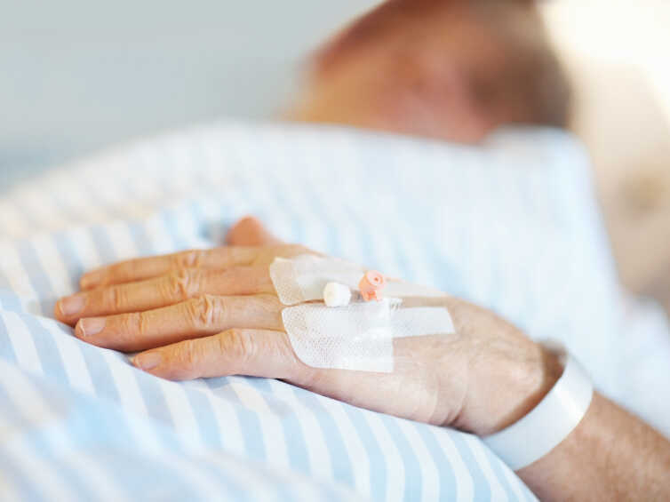 Patient lying on a bed.