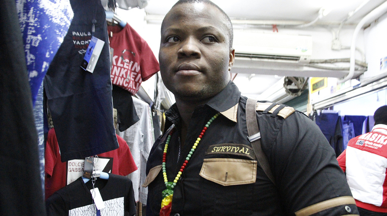 In the southern Chinese city of Guangzhou, thousands of African immigrants, many of them small-scale clothing traders from Nigeria, have come seeking business opportunities. One of the Nigerian traders, who goes by his "designer name" of Niceguy, is shown here in the city's Little Africa neighborhood. (Nina Porzucki for NPR)