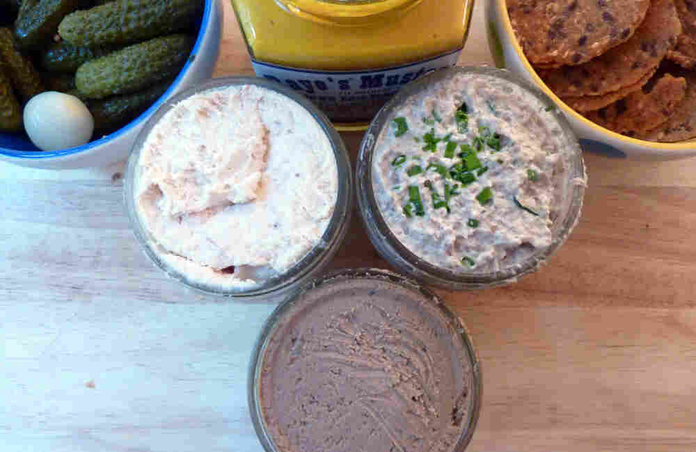 Smoked Trout Pate (left), Tuscan Chicken Liver Pate and Mushroom Pate (right) are served with cornichons, mustard and crackers.