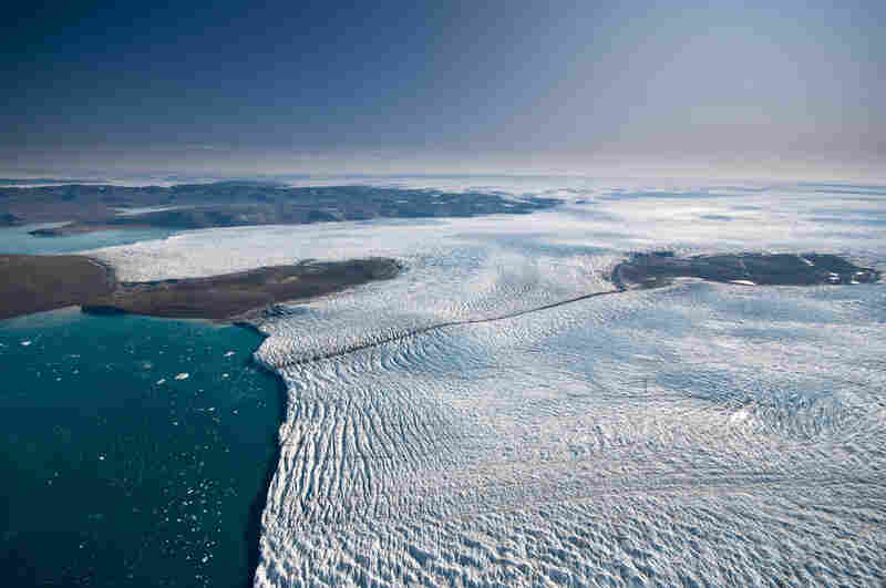 Researchers studying Greenland's ice say it is melting more slowly than previously thought. Here, ice travels down a relatively small outlet glacier into the sea. 