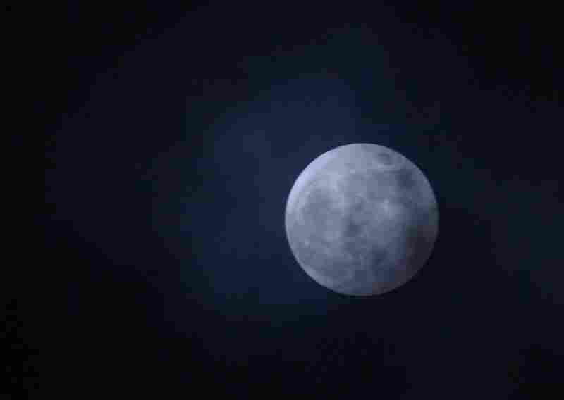 The moon hangs over Chevy Chase, Md., Saturday night. 