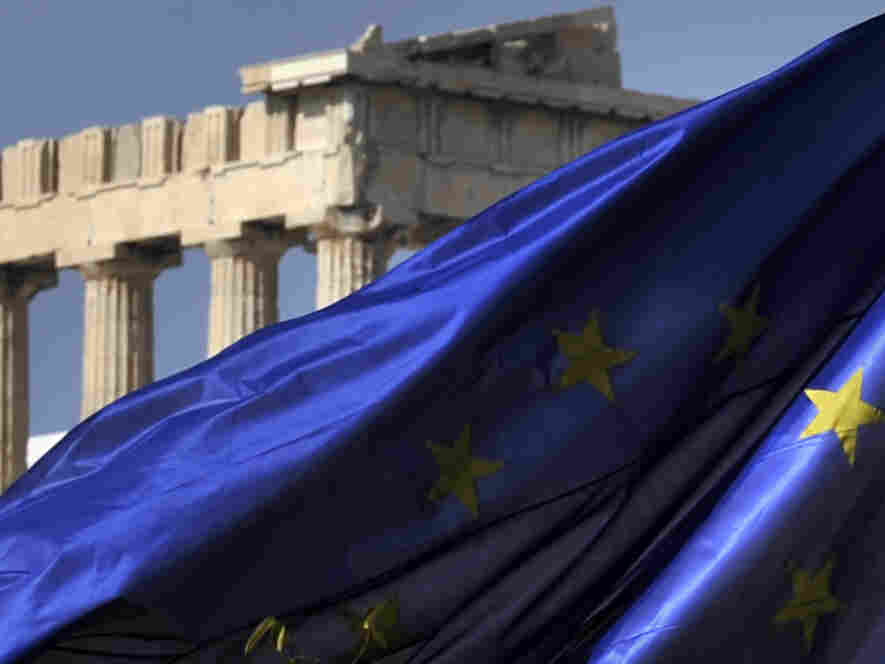 The European Union flag flies in front of the Parthenon in Athens.