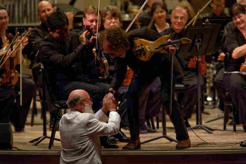 Terry Riley (center), one of the founders of minimalism, now often writes music lush with melody, drawing on a variety of American and world music influences. 