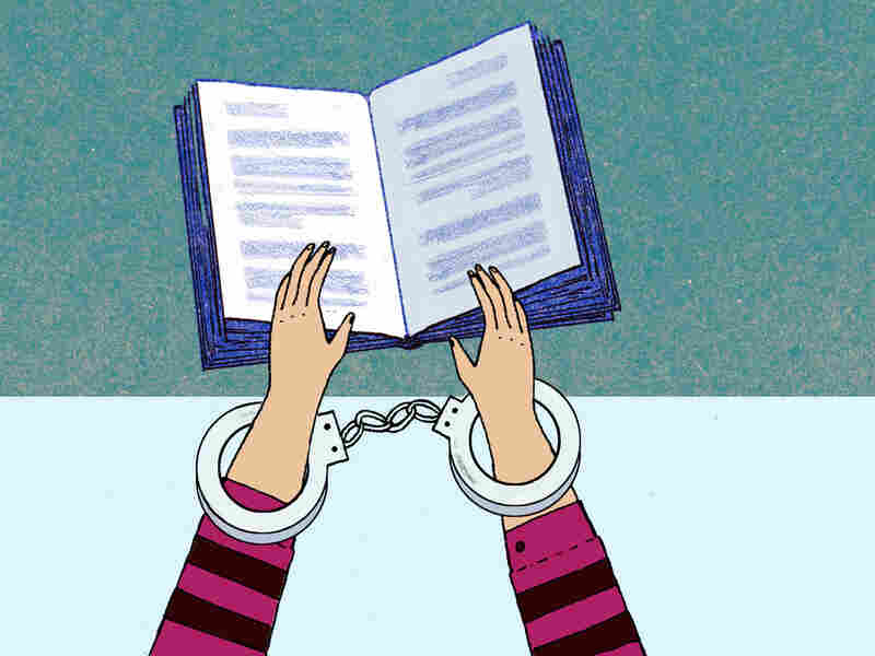 Illustration: Handcuffed hands hold a book.