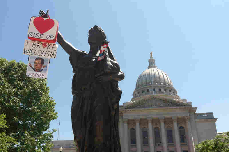 The statue, "Forward", circa 1893, stands in front of the capitol building. "Forward" is the state motto, and both campaigns have been using that motion in their ads.