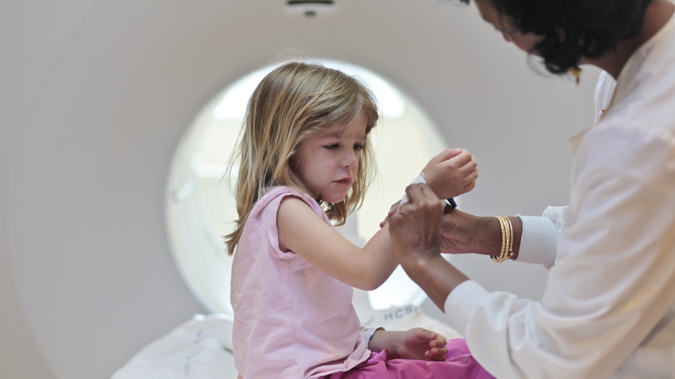 Isabel Doran, 4, gets a CT scan at Children's National Medical Center with her mom, Veronica Doran. The X-ray radiation in CT scans raises the risks for cancer, including leukemia, a new study shows. (Dayna Smith/The Washington Post/Getty Images)