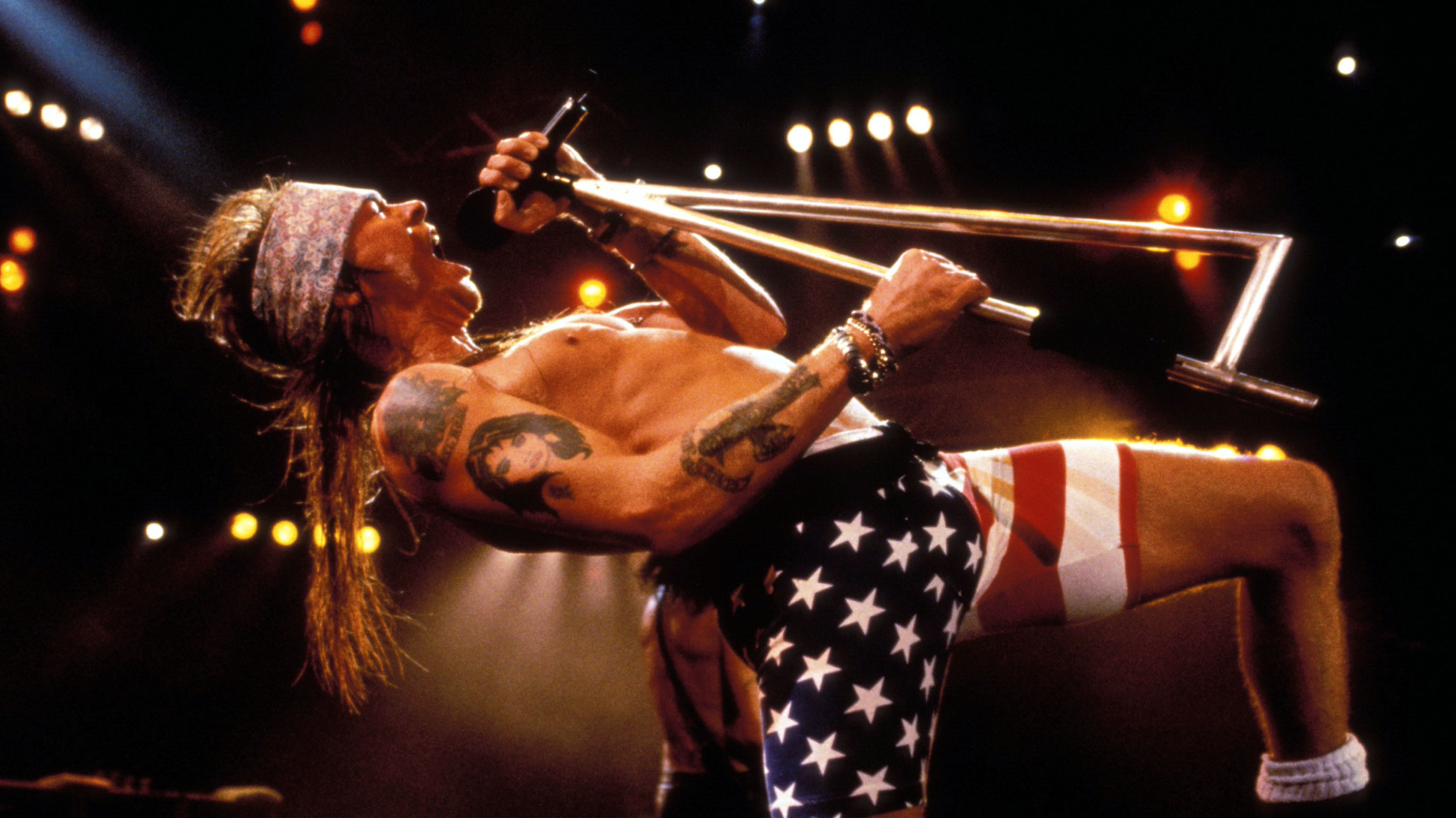 Axl Rose onstage. In American flag bike shorts. (WireImage)