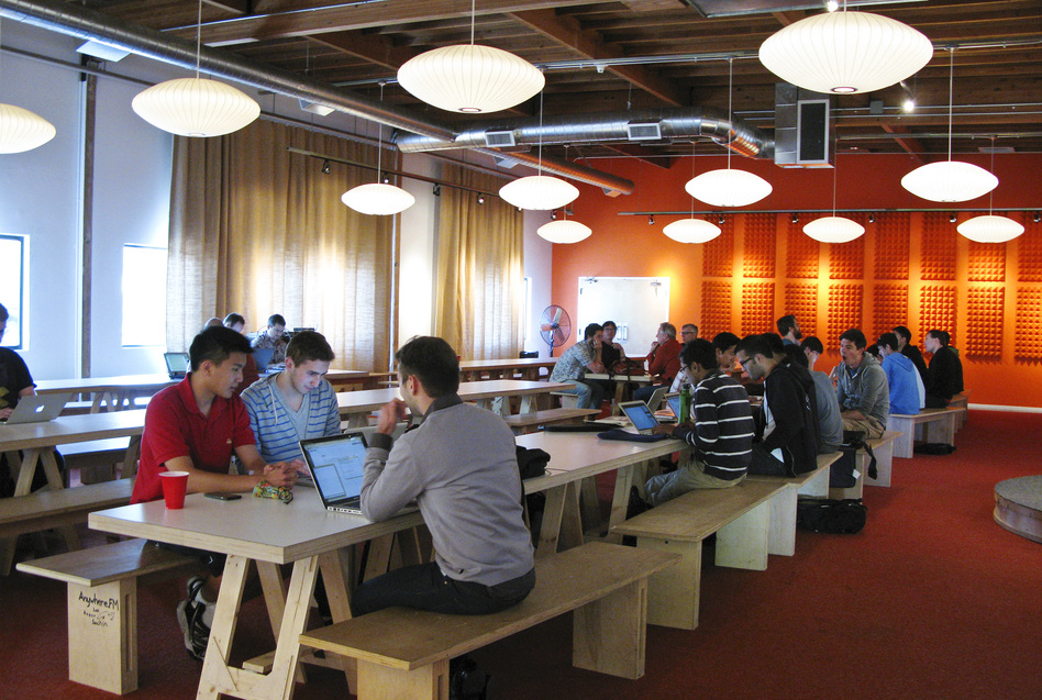 Tech entrepreneurs gather at the offices of Y Combinator, a company based in Mountain View, Calif., that provides seed money to young startups. Founder Paul Graham predicts half of the startups funded by Y Combinator will ultimately fail. (Melissa Block/NPR)