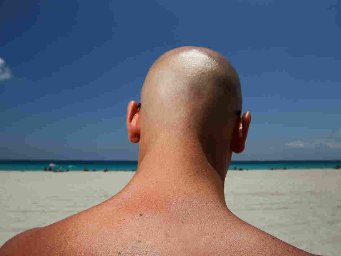 Stefano Amabili walks under the sun on the beach on May 10, 2012 in Miami Beach, Florida.