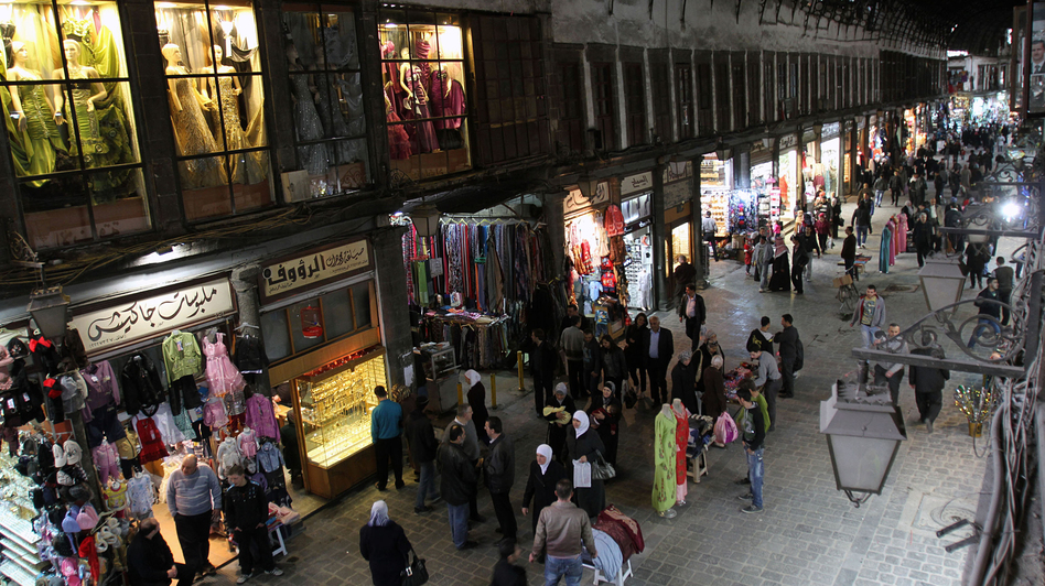People walk through Hamidiyah market in Damascus, Syria, Feb. 28. The merchants of this landmark bazaar were once ardent supporters of President Bashar Assad. That's no longer the case. (Bassem Tellawi/AP)