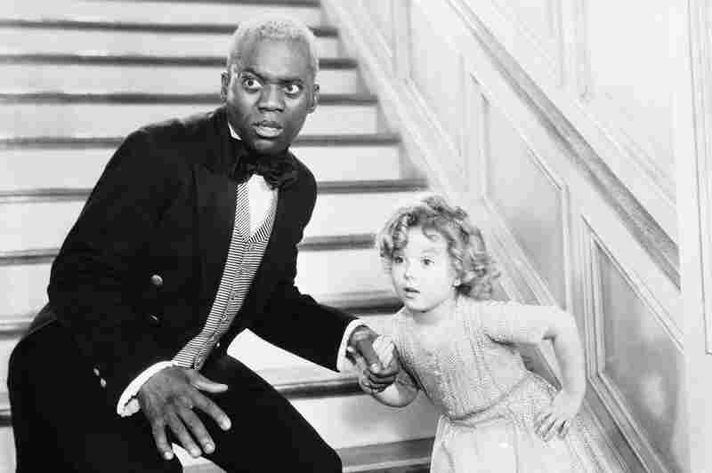 Bill Robinson, as the butler, teaches Shirley Temple his world-famous stair dance in a scene from The Little Colonel in 1935.