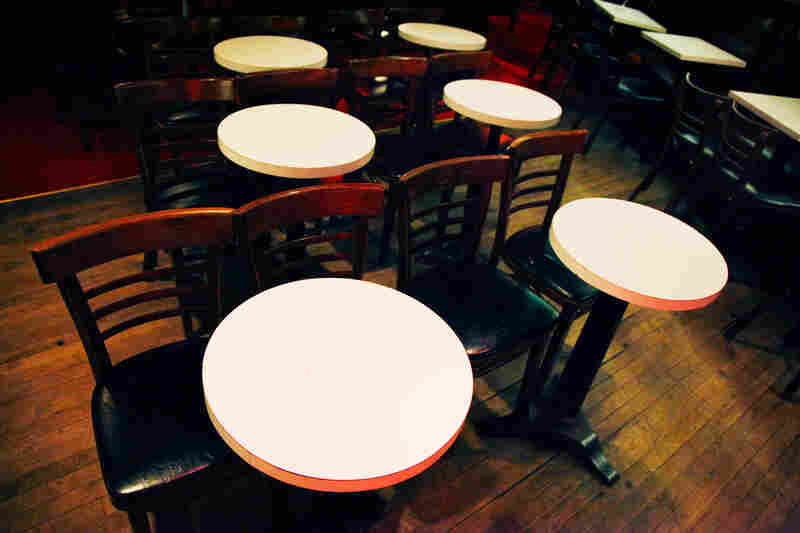 In the interest of accommodating lots of people, tables and chairs should take up as little real estate as humanly possible.