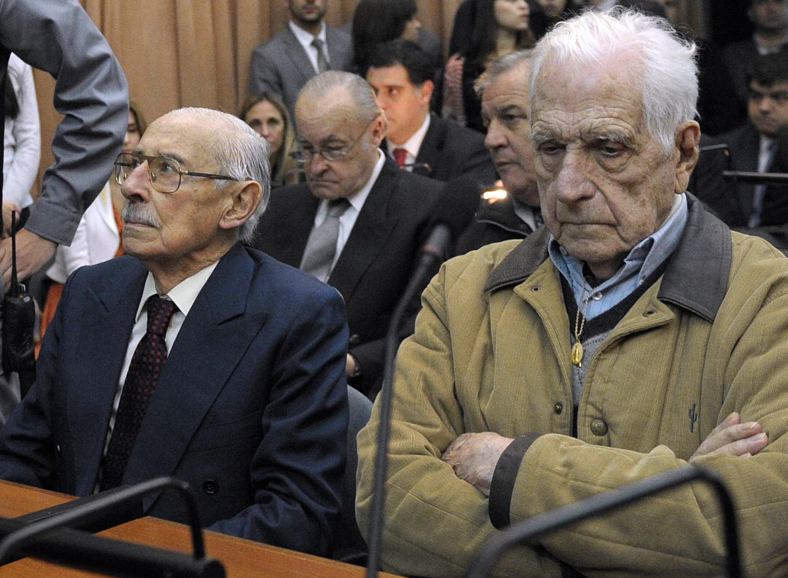 Former dictator and Gen. Jorge Rafael Videla (left), and former general and member of the military junta Reynaldo Bignone in a Buenos Aires court on Thursday. (AFP/Getty Images)