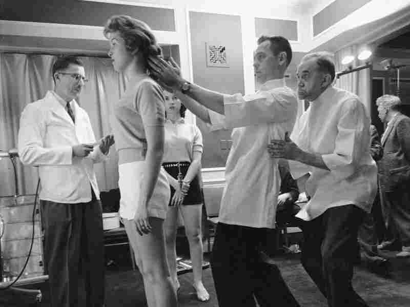 Chiropractors check the posture of Marianne Baba.