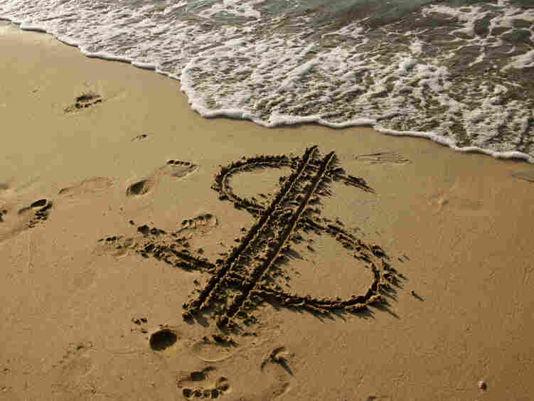 Dollar sign in the sand
