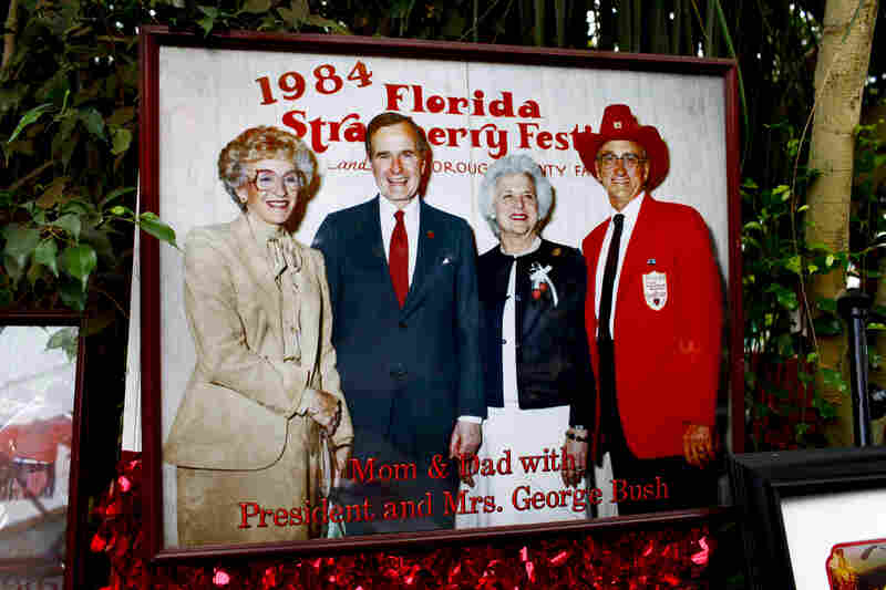 The Meeks display a large photo of themselves posing with George and Barbara Bush in 1984. The market has become a "must-visit" destination for presidential candidates.