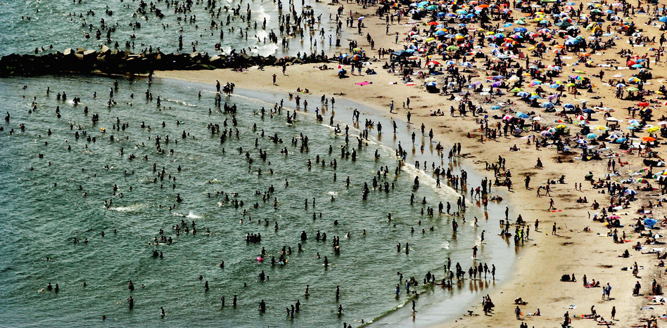 According to the National Oceanic and Atmospheric Administration, the past year through June 2012 has been the hottest year in the continental U.S. since modern record-keeping started in 1895. Above, New Yorkers flocked to Coney Island to try to beat the heat in early August. (Mario Tama/Getty Images)