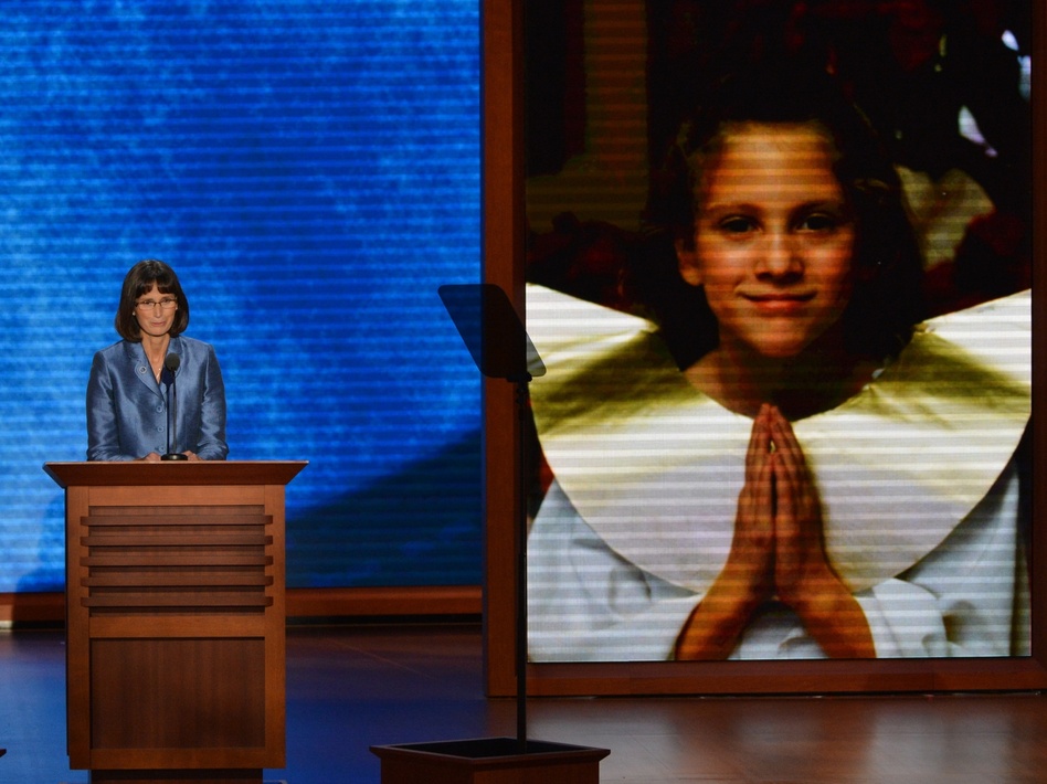 Pam Finlayson from California tells of how Mitt Romney helped her family when her daughter was ill and after the young woman died. (Stan Honda /AFP/Getty Images)
