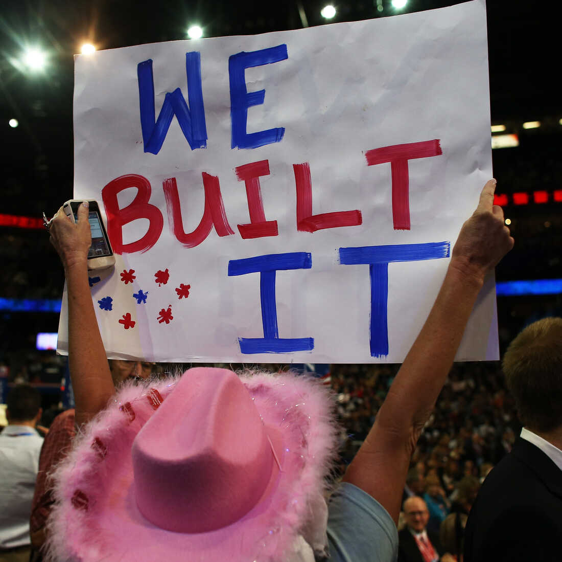 A woman holds a sign at the Republican National Convention Tuesday in Tampa, Fla.