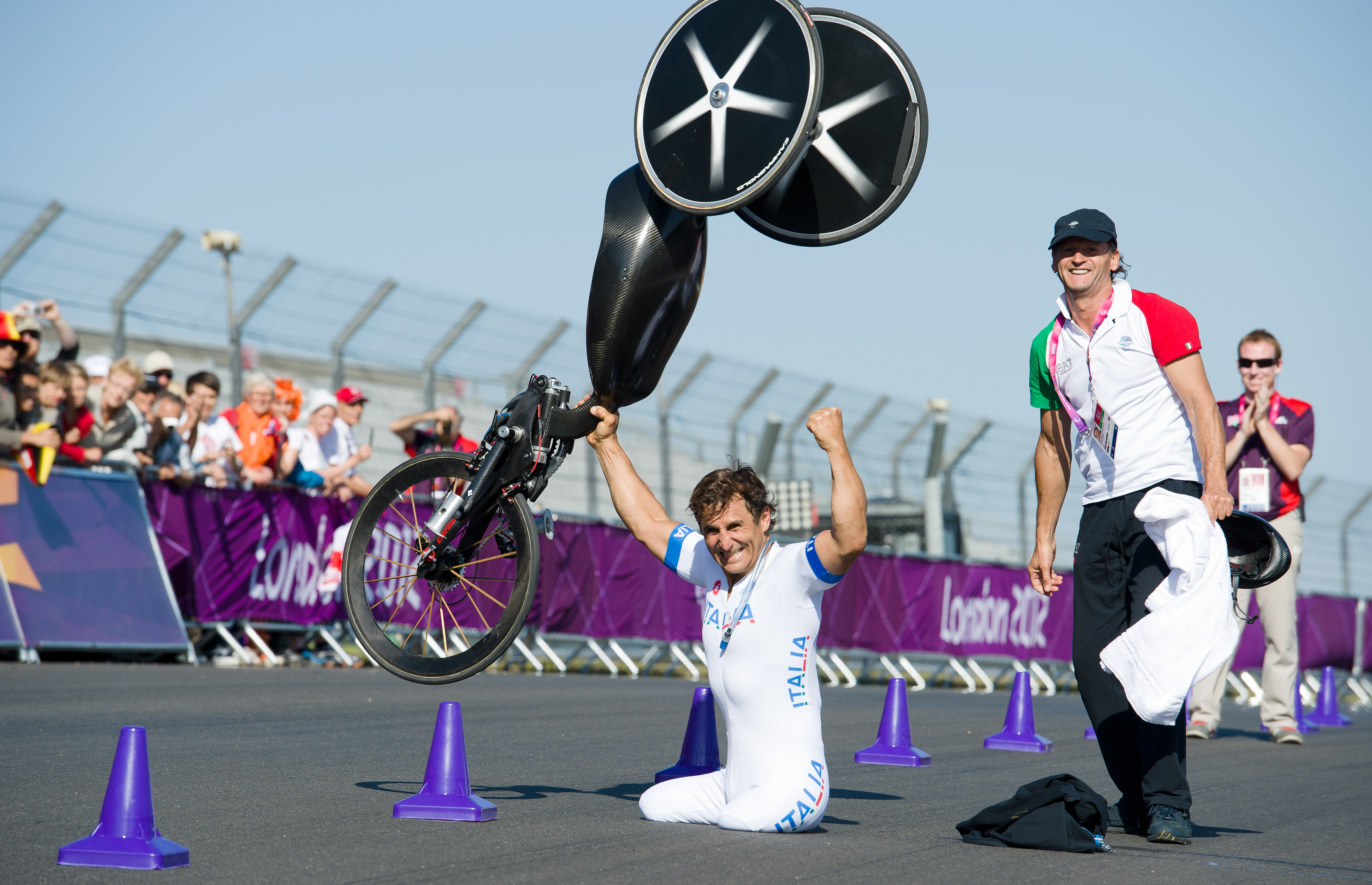 Alex Zanardi celebrates winning the gold medal in the men's individual H4 time trial cycling final at the London 2012 Paralympic Games at Brands Hatch circuit, in Kent, southern England. Zanardi's legs were amputated after a racecar crash in 2001. (AFP/Getty Images)