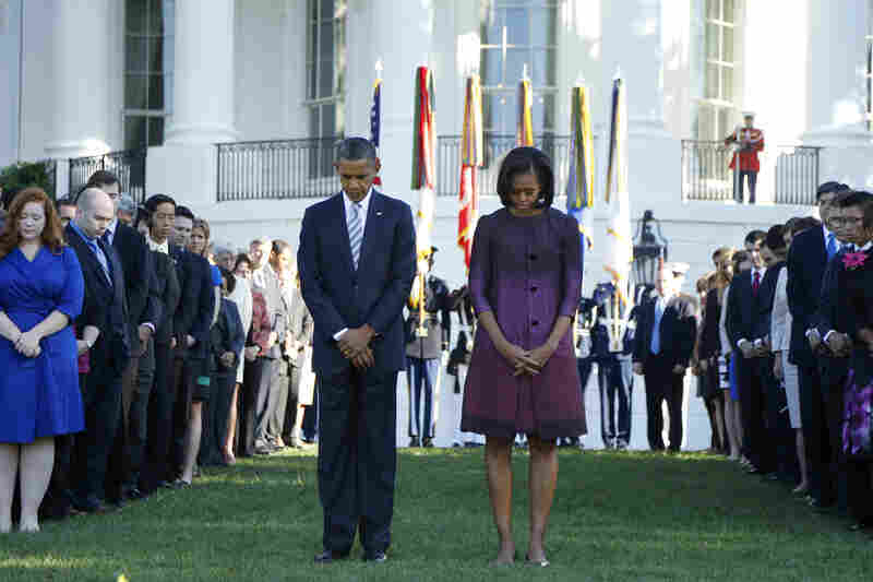 President Obama, first lady Michelle and members of the White House staff pause for a moment of silence to mark the anniversary on the South Lawn of the White House.