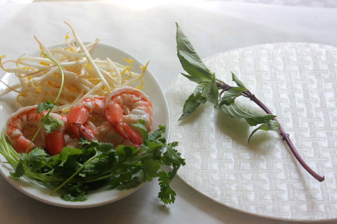 Ingredients for Classic Summer Rolls, including bean sprouts, shrimp, rice paper and fresh mint and cilantro