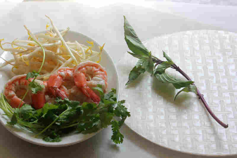 Ingredients for Classic Summer Rolls, including bean sprouts, shrimp, rice paper and fresh mint and cilantro