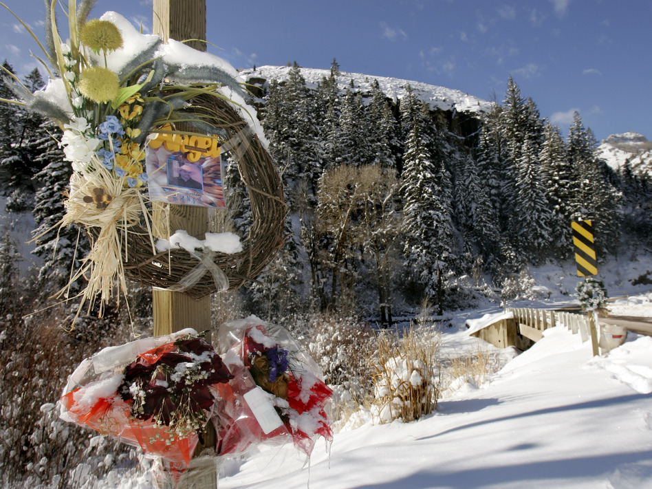 Wreaths and flowers commemorating those killed in the Crandall Canyon Mine collapse are posted at the mine entrance on Dec. 10, 2007, outside Huntington, Utah. A settlement Thursday includes mine owner Murray Energy's acceptance of four violations considered "contributory" to two fatal August 2007 mine collapses at Crandall Canyon. (Douglas C. Pizac/AP)