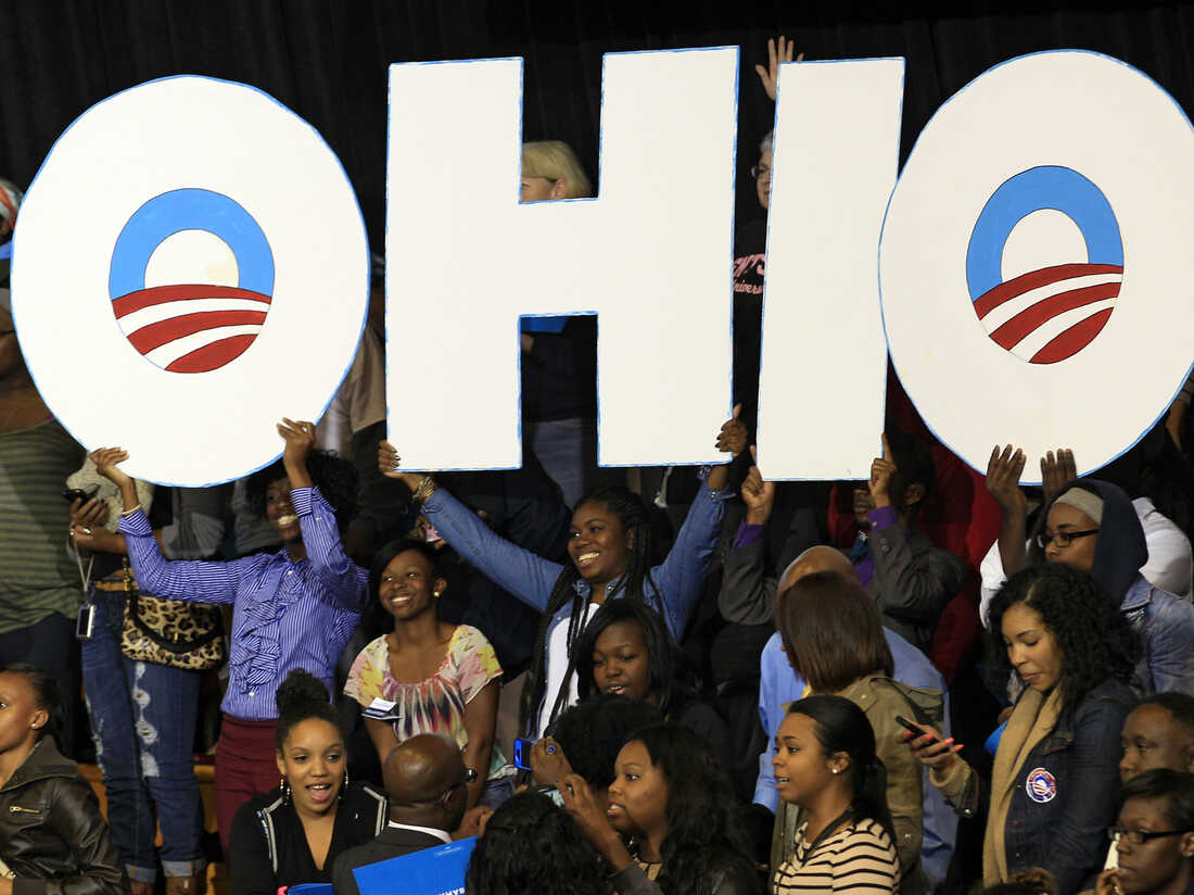 Supporters hold up an Ohio sign as President Obama speaks at a campaign event at Kent State University on Wednesday in Kent, Ohio.