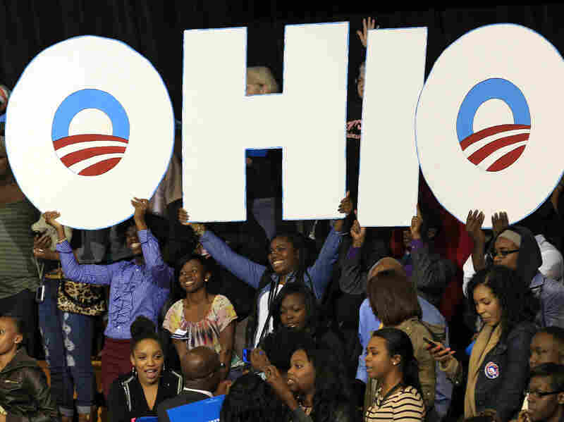 Supporters hold up an Ohio sign as President Obama speaks at a campaign event at Kent State University on Wednesday in Kent, Ohio.