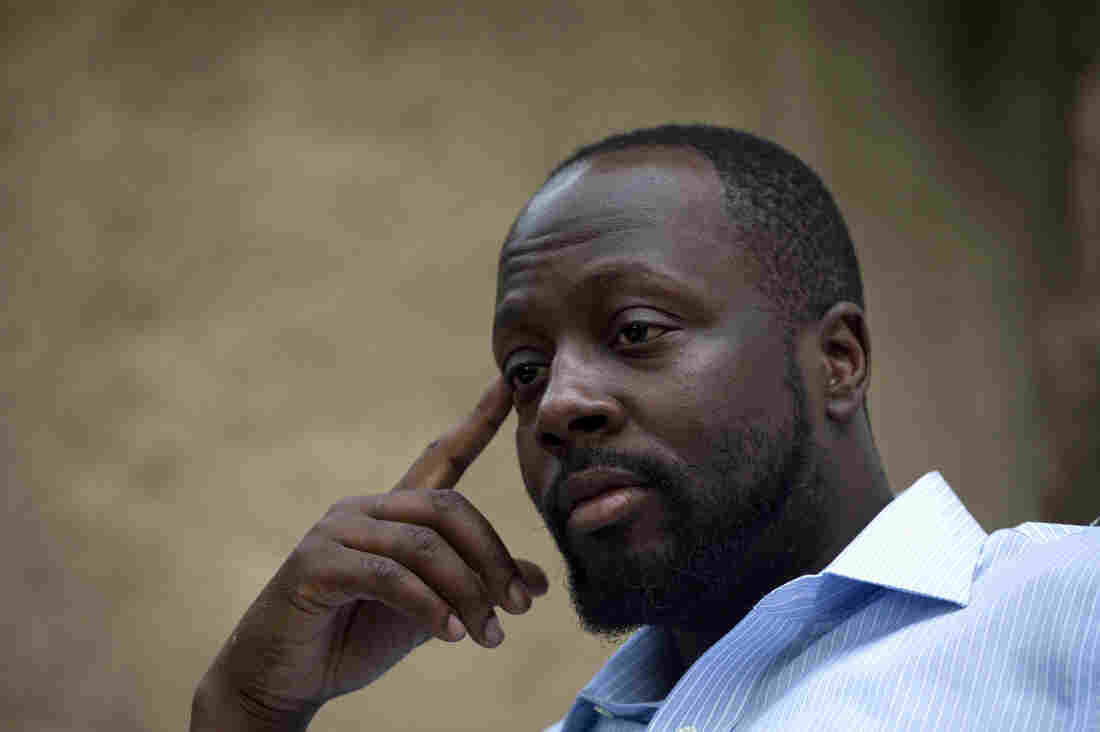 In this Aug. 18, 2010 file photo, Haiti's presidential candidate and hip hop singer Wyclef Jean, speaks during an interview at his mother's house in Croix de Bouquets, Haiti. (AP Photo/Ramon Espinosa, file)