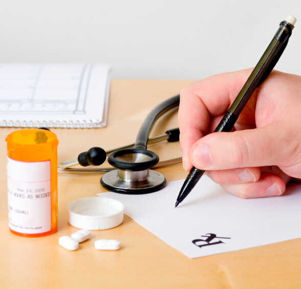 Doctor writing a prescription.