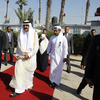 Qatari Emir Sheikh Hamad bin Khalifa al-Thani (center right) walks alongside Gaza's Hamas prime minister Ismail Haniya (center left) during a welcome ceremony at the Rafah border crossing with Egypt on Tuesday. Qatari Emir Sheikh Hamad bin Khalifa al-Thani (center right) walks alongside Gaza's Hamas prime minister Ismail Haniya (center left) during a welcome ceremony at the Rafah border crossing with Egypt on Tuesday.