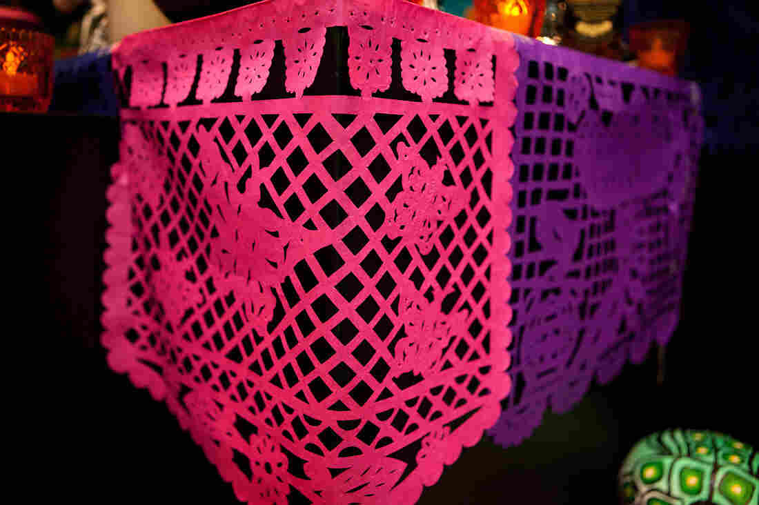 Papel picado: Delicately decorated tissue paper is used to represent wind and the fragility of life.