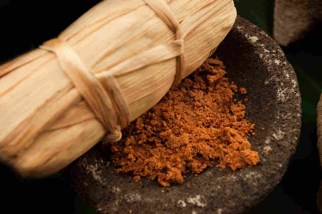 Food: The ancestor's favorite meals are placed on the altar as offerings. Here, Tamale is being served. Tamales are made from corn-based dough, wrapped in cornhusk then steamed. They are filled with a variety of ingredients like shredded chicken in a green spicy sauce or sweetened with pineapple-cinnamon jellies