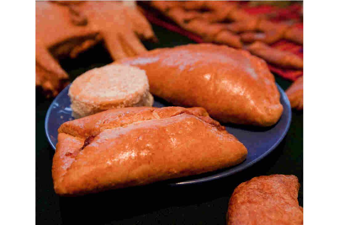 Pan de Muertos: Semisweet breads are baked with a small human figurine inside. It's considered good luck to find the tiny surprise in your slice. Breads are also used to represent the soil.