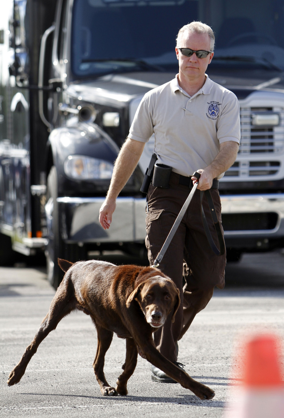 Miami-Dade Detective Douglas Bartelt and narcotics detector canine Franky give a demonstration in Miami in 2011. (Alan Diaz/AP)