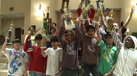 The pint-sized pros of I.S. 318 are kings of the chess board (and have the trophies to prove it).