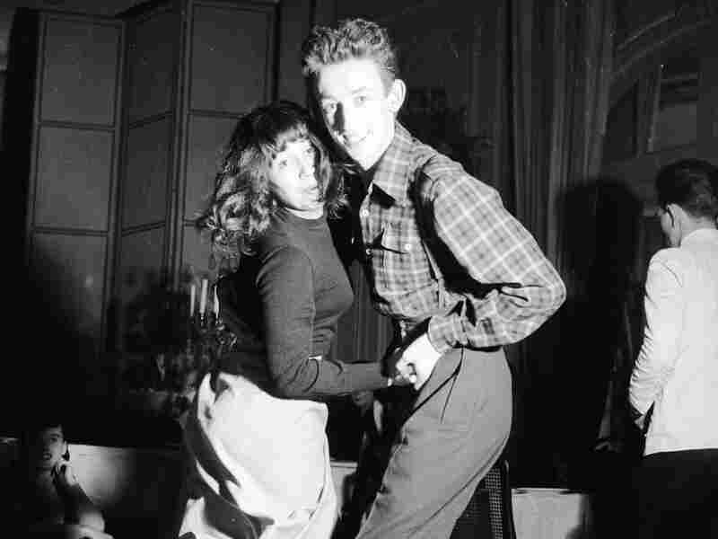 Baseball-booted students jitterbugging at the Carrere night club in Paris.